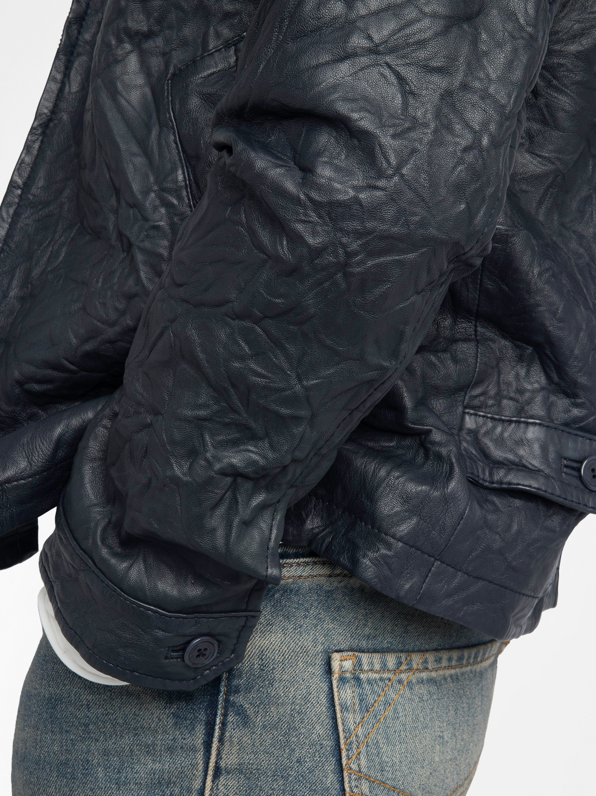 Loumy Leather Jacket - Clean crinkled leather jacket with zip fastening, piped pockets and embossed wings signature on back.